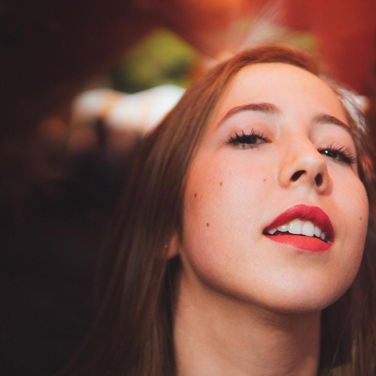 Ari Patel, Lead Design Curator at Daily Learning Studio, reviewing corporate floral arrangements